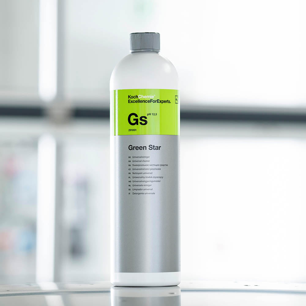 Koch Chemie Green Star | Universal Cleaner 1L bottle with blurry background on car