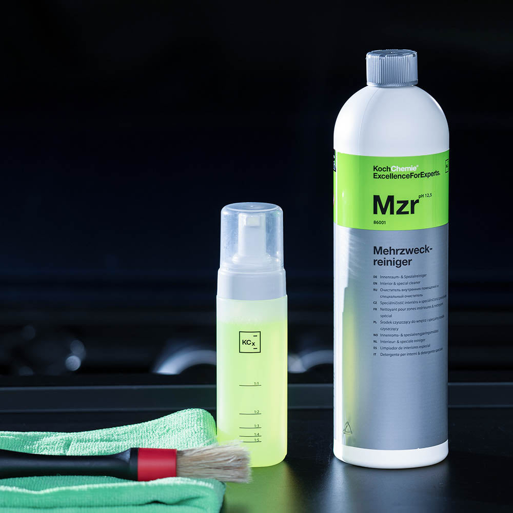 Koch Chemie Mehrzweckreiniger (MZR) | Interior & Special Cleaner 1L bottle next to a variety of detailing products