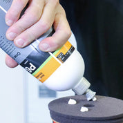 Koch Chemie One Cut & Finish P6.01 | High Gloss Polish With Sealant being applied to a black polishing pad.