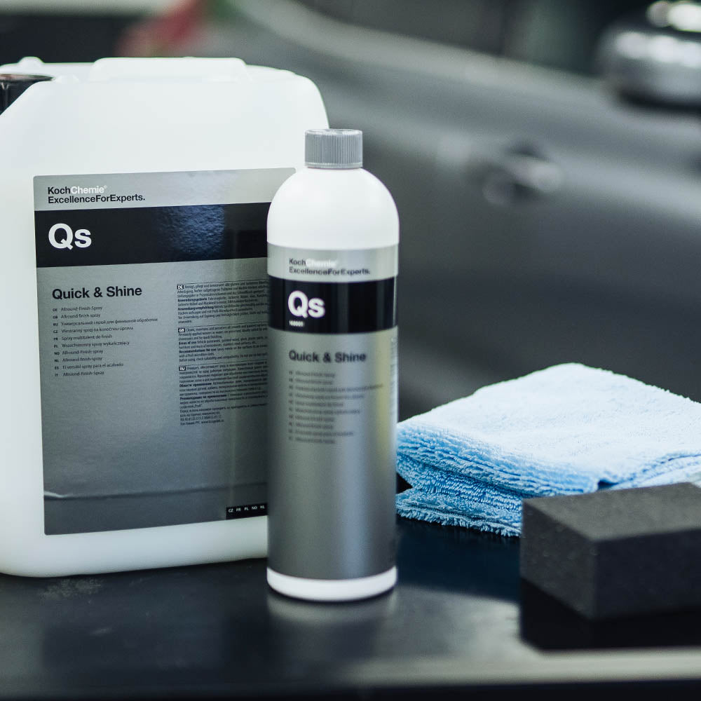 Koch Chemie Quick & Shine | Universal Quick Detailer 1L bottle in foreground with a microfiber cloth and 5L bottle in the background.