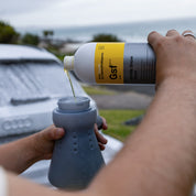 Koch Chemie Gentle Snow Foam | pH Neutral Cleaning Foam 1L bottle being poured into a foam cannon bottle.