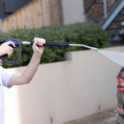 MTM Hydro Short Gun, MTM Hydro lance and Aquatouch nozzle, spraying onto black car.